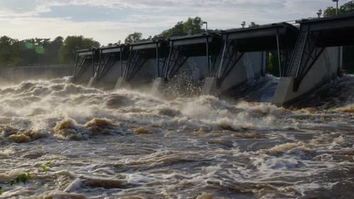 Waters browned out of hydro dam. very dirty water overflows from the fields and mountains out of the