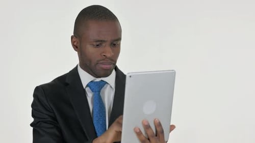 Man in Suit Reacts to News on Tablet