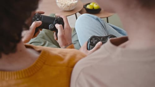 Young Adults Playing Video Games at Home