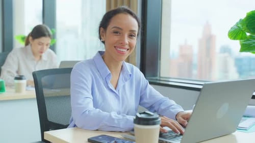 Portrait of Latino beautiful business woman smile while work in office