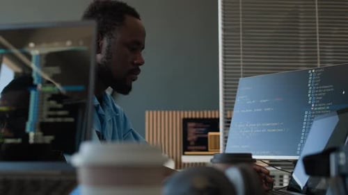 Young Black Programmer Developing Code