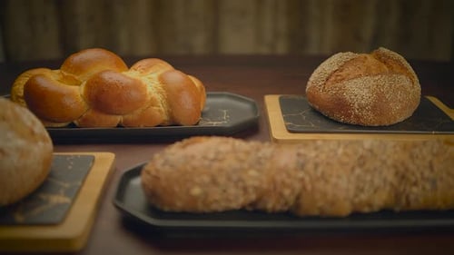 Variety of Bread Types on Table Staple Food Baked Goods Cooking Ingredient