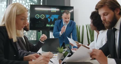 Diverse Business Team Brainstorming in Modern Office