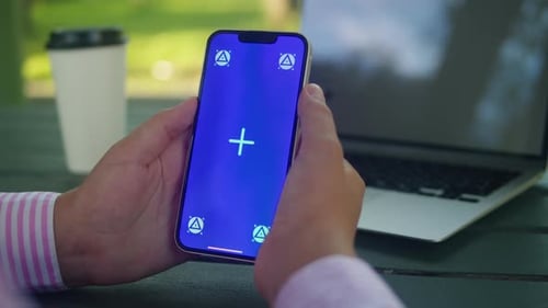 Woman Hand Holding Phone with Chroma Key Screen Outdoor Smartphone with Green Screen Closeup