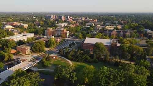 Michigan State University facilities surrounded with green trees, aerial view