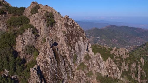 Aerial view along the cliff-side of a mountain