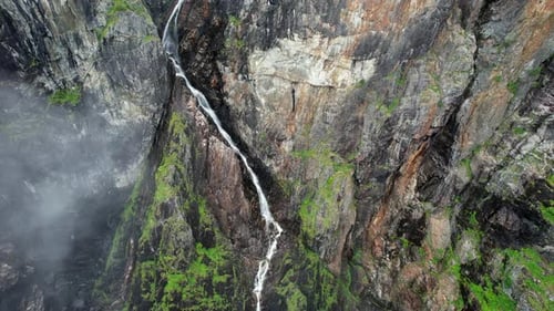 Waterfall Flowing Down Rocky Cliff – Voringsfossen Norway Aerial