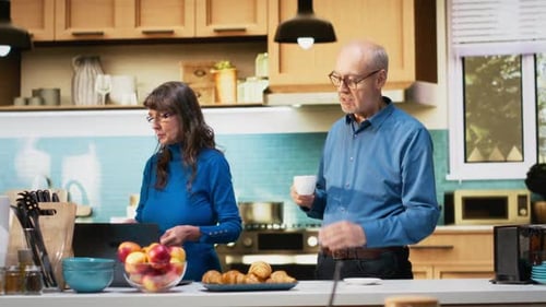 Couple Chatting in Bright Kitchen During Breakfast