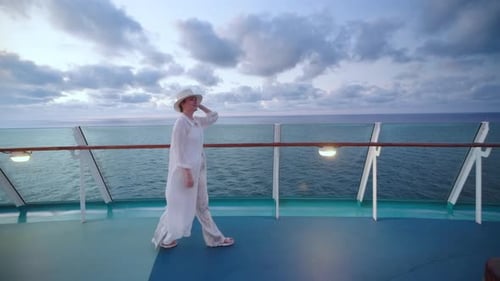 Woman Walks on Cruise Ship at Sunset