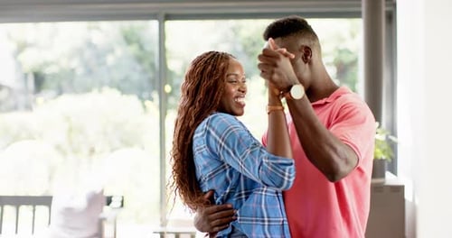 Romantic Couple Dancing Together Indoors at Home