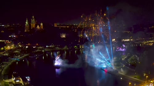 Fireworks over Wawel Royal Castle and Vistula river in Krakow during Dragon Parade, Poland.