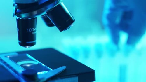 Microscope and a Tube with Virus Closeup of Scientific Laboratory in Hospital Epidemic Disease