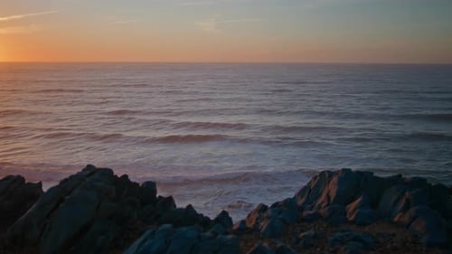 Panoramic Ocean Sunset View with Peaceful Seascape Ocean Water Reflecting Glow