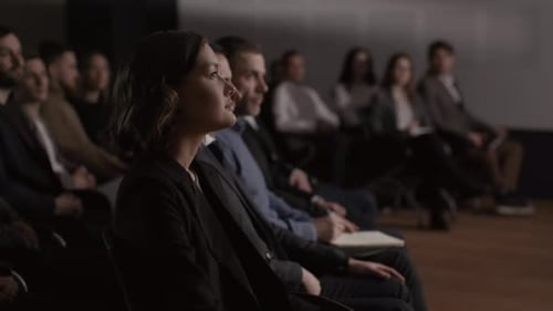 Audience Watching Presentation in Dark Room