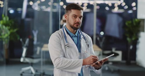 Doctor Using Tablet in Modern Medical Office