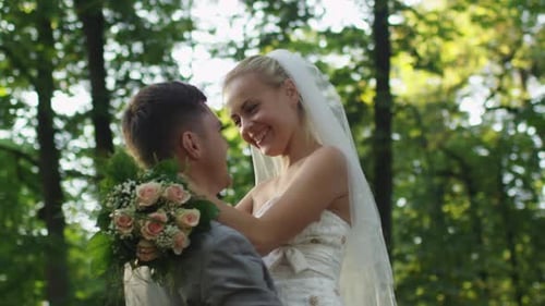 Romantic Couple Embracing in Forest on Wedding Day