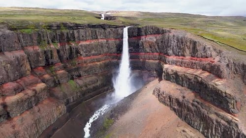 Aerial view of Hengifoss waterfall in scenic landscape, Iceland.