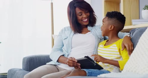 Woman and Child Play on Tablet at Home