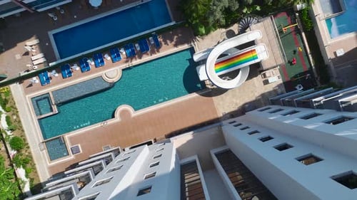 Aerial View Luxury Residential Complex With Azure Pool and Water Slides for Kids By the Sea