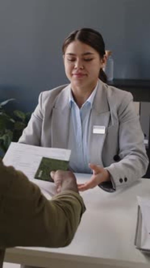 Vertical of Black Man Having Visa Interview in Consulate