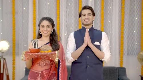 Couple Performing Traditional Diwali Ritual at Home