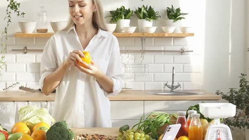 Blonde Woman Presenting Vegetables in Bright Kitchen