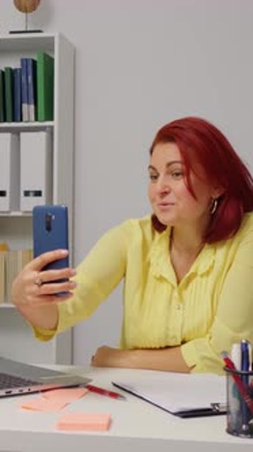 Woman Holding a Video Call at her Desk