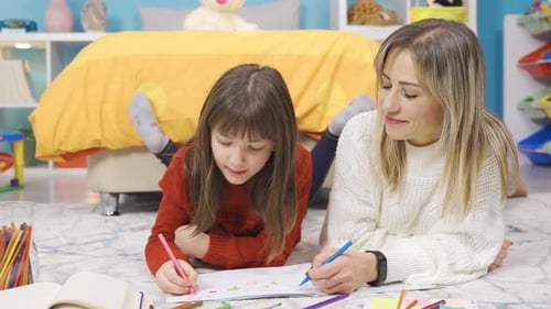 Mother and Child Drawing Together at Home