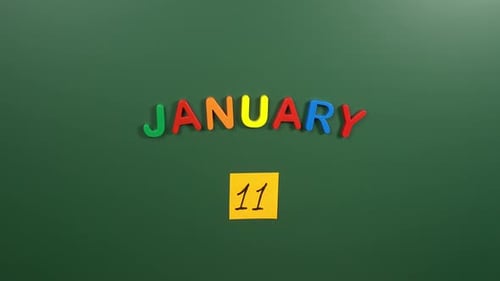 Hand sticking a sticker 11 January calendar day on school board. 11 date of January. Eleventh day