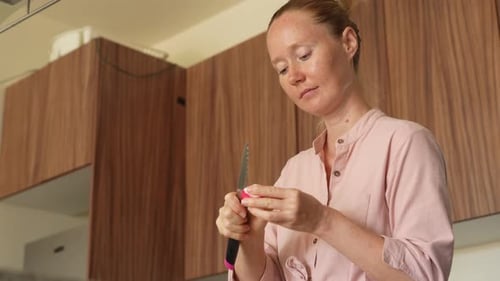 Woman Prepares Vegetables in Her Kitchen