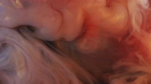 Orange White and Gold Paint Swirls in Liquid