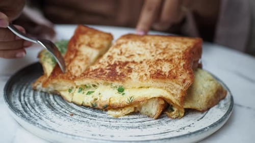 Toasted Sandwich Cut with Knife and Fork