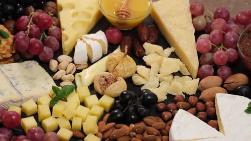 Cheese Board with Grapes, Nuts, and Figs