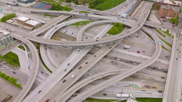 Multiple cars moving quickly by the turns and loops of complicated road ...