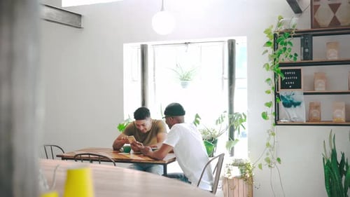 Men, coffee shop and phone for social media, online planning and talking