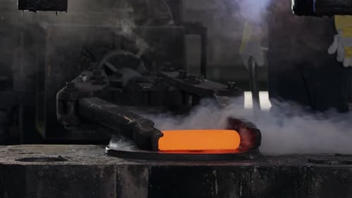 Forging Hot Metal at Manufacturing Factory