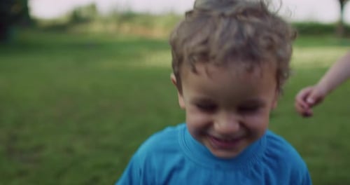 Smiling Child Outdoors in Daylight