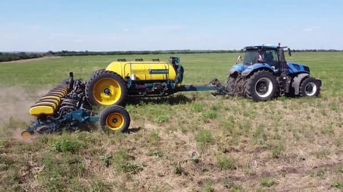 Blue Tractor O.A. Planting Canola On No Till Field