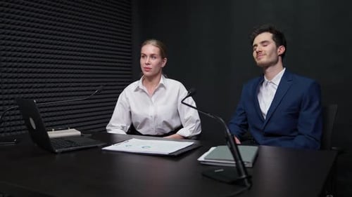 Handheld News Anchors at Work Woman and Man Journalists Communicate with Opponents View of a
