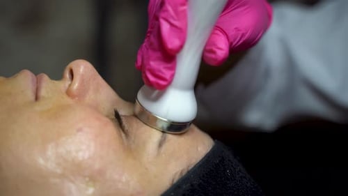 Woman Receiving Forehead Beauty Treatment