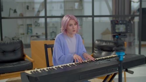 Woman Plays Keyboard and Sings in Airy Room