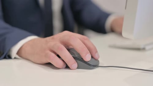 Close up of Businessman Using Computer Mouse