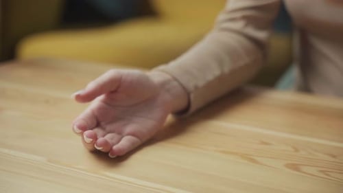 Woman Taking Pill with Water in Home
