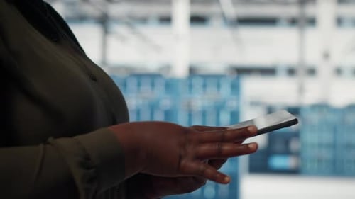 Close Up of Data Center Software Developer Doing Data Analysis on Tablet