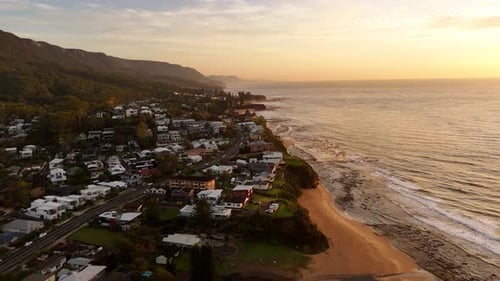 Coastal Town at Sunrise: Scenic Aerial View