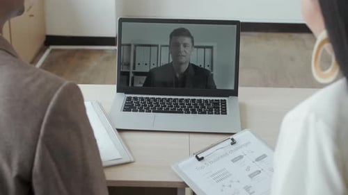 Colleagues in a Virtual Meeting Discussing Business