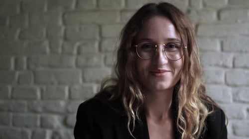 Young Woman Working on Her Laptop Computer in Coffee Shop