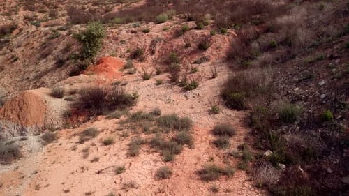 Flying Over A Rocky and Arid Terrain