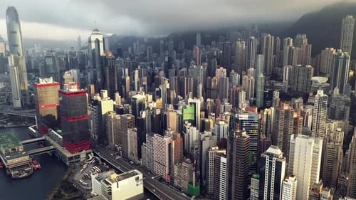 Drone, city and buildings, skyscraper and architecture outdoor in urban development in Hong Kong