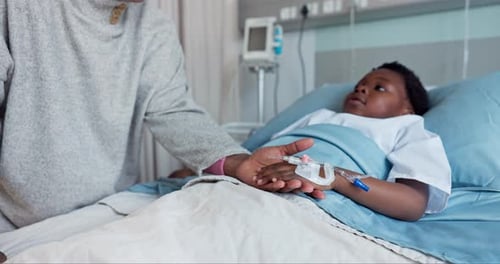 Kid, patient and hospital with comfort by parent for care, treatment or wellness in medicine with IV